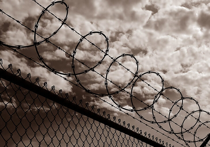 Black and white image of Razor Wire Security fence
